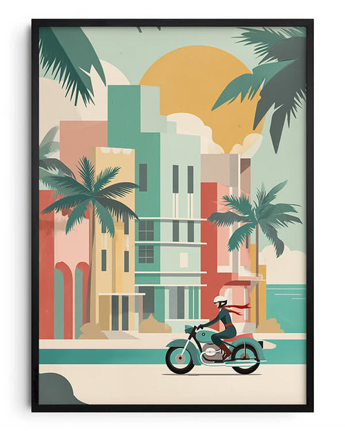 A framed art print featuring a retro-style vector illustration of a person riding a motorcycle along a tropical beach street with palm trees and colorful buildings under a large sun.